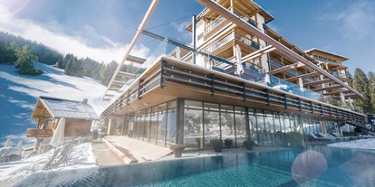 Luxusurlaub - Saunalandschaft: Dampfbad - Leogang - Pool Winter DAS.GOLDBERG - Das Goldberg