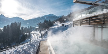 Luxusurlaub - Saunalandschaft: Aromasauna - Österreich - Pool Winter DAS.GOLDBERG - Das Goldberg