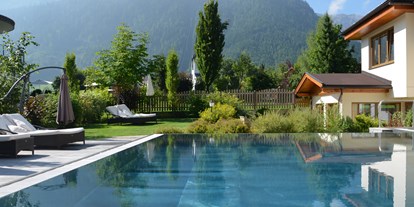 Luxusurlaub - Saunalandschaft: Dampfbad - Reith im Alpbachtal - Außenpool Verwöhnhotel Kristall - Verwöhnhotel Kristall