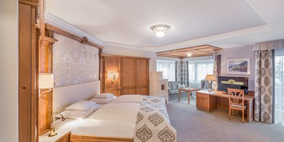 Luxusurlaub - Saunalandschaft: finnische Sauna - Scuol - Doppelzimmer Grand de Luxe - Trofana Royal *****Superior Resort