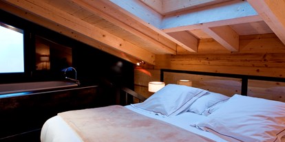Luxusurlaub - Saunalandschaft: finnische Sauna - Zermatt - Junior Suite - Unique Hotel Post Zermatt