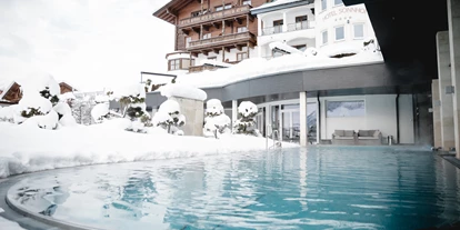 Luxusurlaub - Pools: Innenpool - Leogang Hütten - sonnhofalpendorf-sonnhof-josalzburg-salzburgerland-wellnesshotel-adultsonly-urlaub-sommer-winter-wellness-ski-skiin-skiout - Sonnhof Alpendorf - an adults only place. 