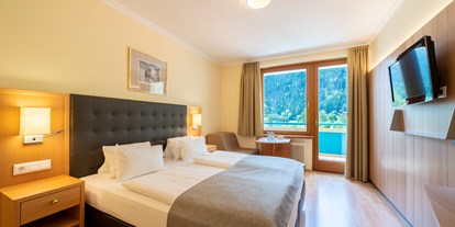 Luxusurlaub - Hotel-Schwerpunkt: Luxus & Golf - Kärnten - Doppelzimmer "Tennisfan" - Familien - Sportresort Brennseehof
