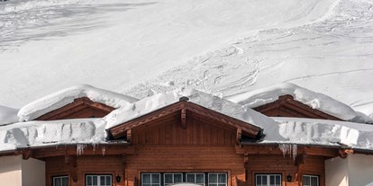 Luxusurlaub - Saunalandschaft: finnische Sauna - Direkter Zugang zur Skipiste - DAS EDELWEISS Salzburg Mountain Resort