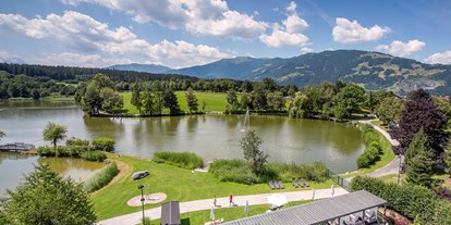 Luxusurlaub - Umgebungsschwerpunkt: See - Pergola und private Liegewiese am Ritzensee - Ritzenhof****S - Hotel & Spa am See