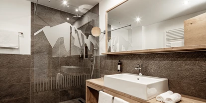 Luxusurlaub - Sen Jan di Fassa - Badezimmer Panoramahotel Huberhof - Panoramahotel Huberhof****s