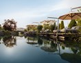 Luxushotel: 750 qm Naturbadesee mit Bio-Filtersystem - 5-Sterne Wellness- & Sporthotel Jagdhof