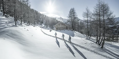 Luxusurlaub - Hotel-Schwerpunkt: Luxus & Familie - Obertauern mit seiner mächtigen Bergkulisse - Hotel Rigele Royal****Superior
