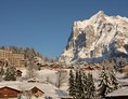 Luxushotel: Hotel Belvedere Grindelwald im Winter mit dem Wetterhorn - Belvedere Swiss Quality Hotel Grindelwald