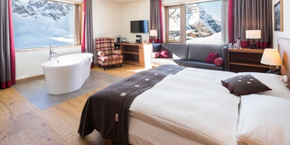 Luxusurlaub - Parkplatz: gebührenpflichtig in Gehweite - Junior Suite mit Badewanne, Winter - Frutt Mountain Resort